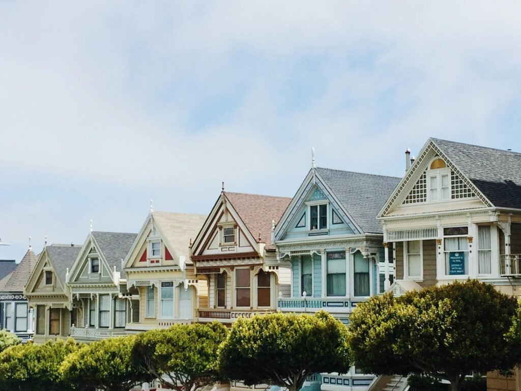 Iconic Painted Ladies Victorian houses in San Francisco with clear blue skies.